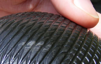 Damage to ball by textured hoop