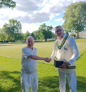 Nigel Polhill presenting Keith Aiton with some glassware